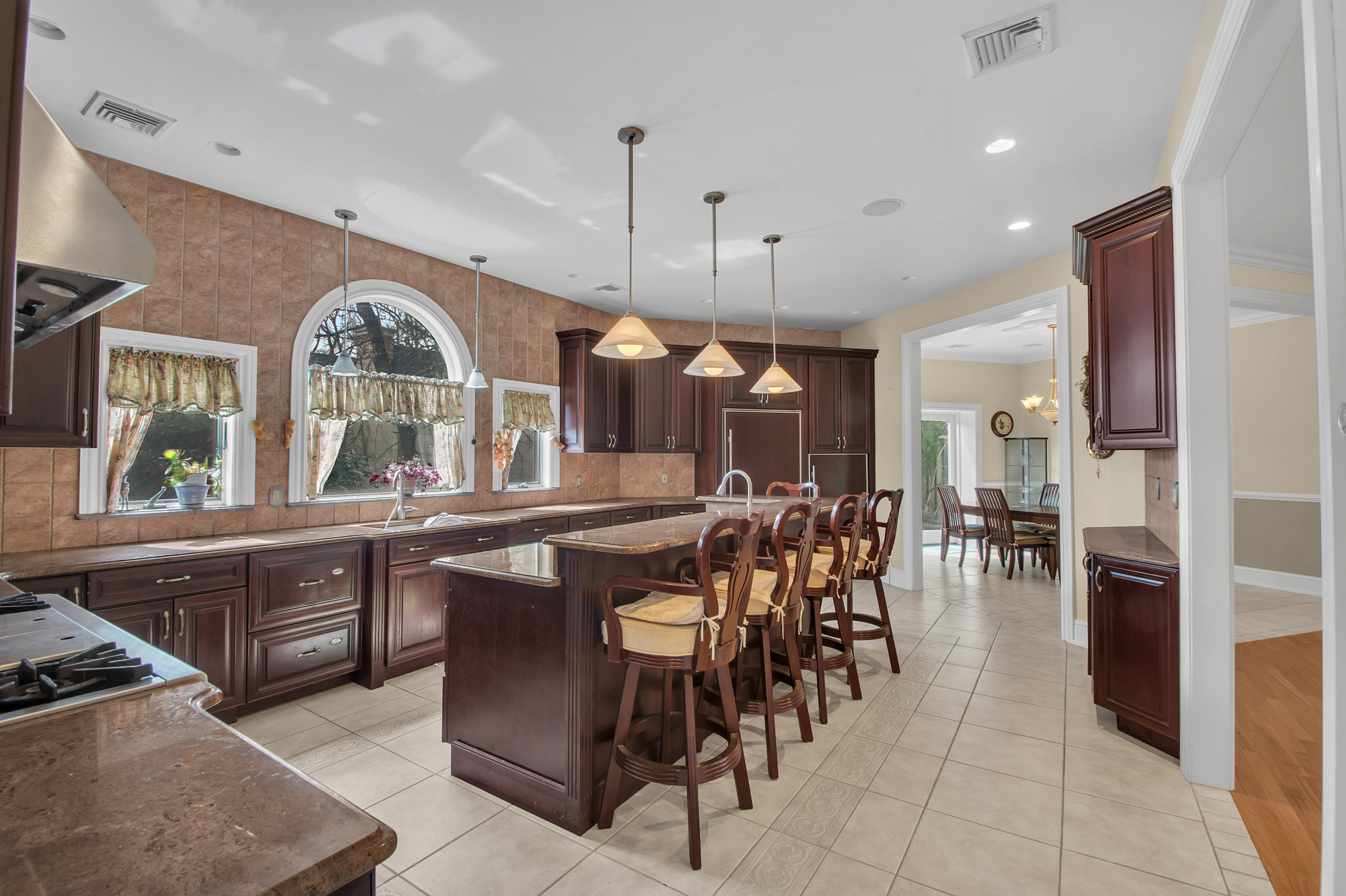 68 Circle Road Staten Island, NY 10304 - Photo 7 of 38 a large kitchen with a table and chairs