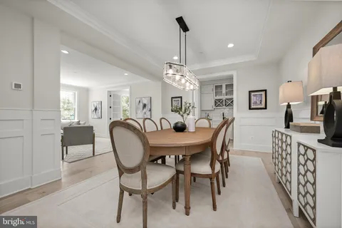 a bathroom with a toilet a sink and a mirror