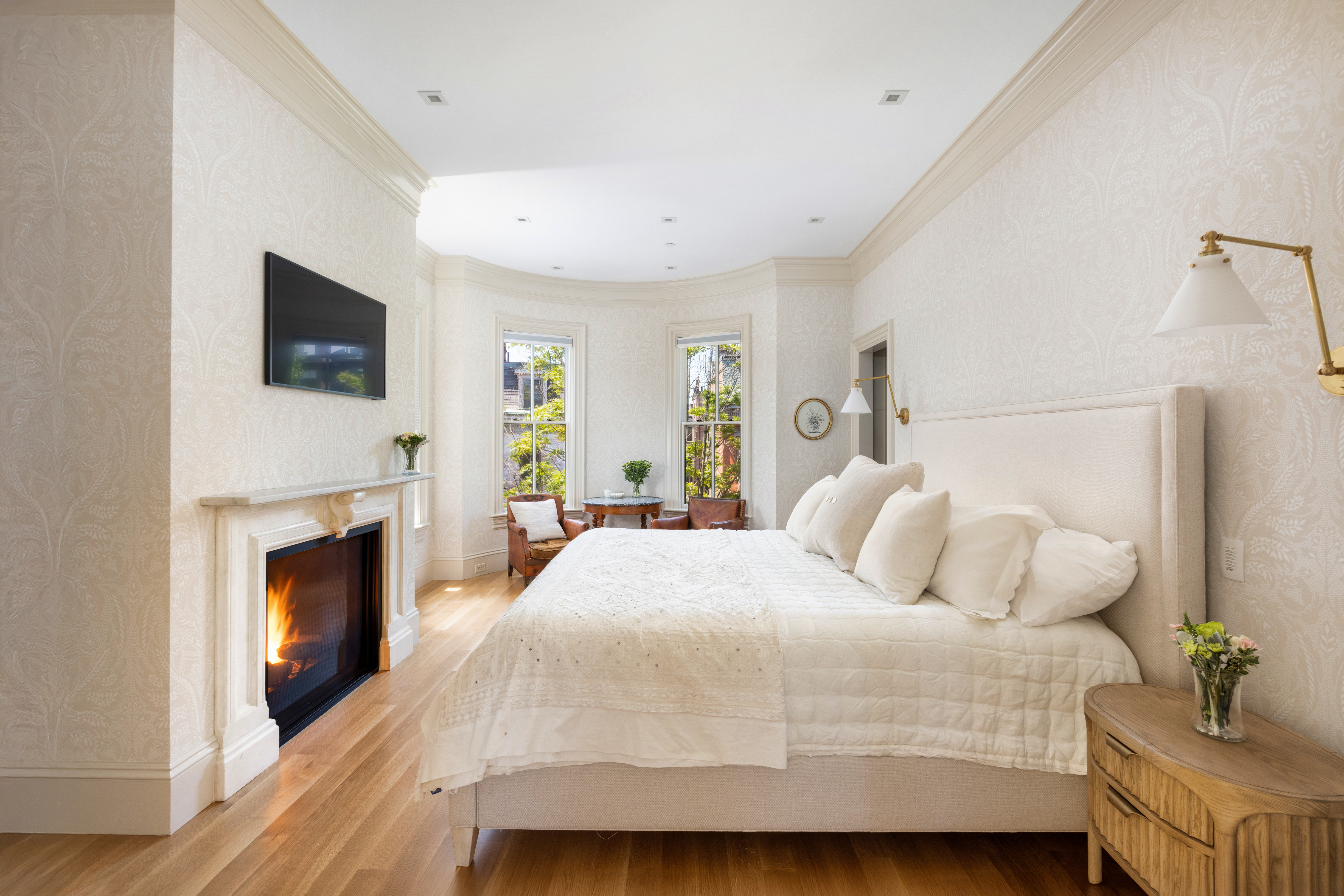 South End Boston, MA 02118 - Photo 11 of 24 a bedroom with a bed and a fireplace