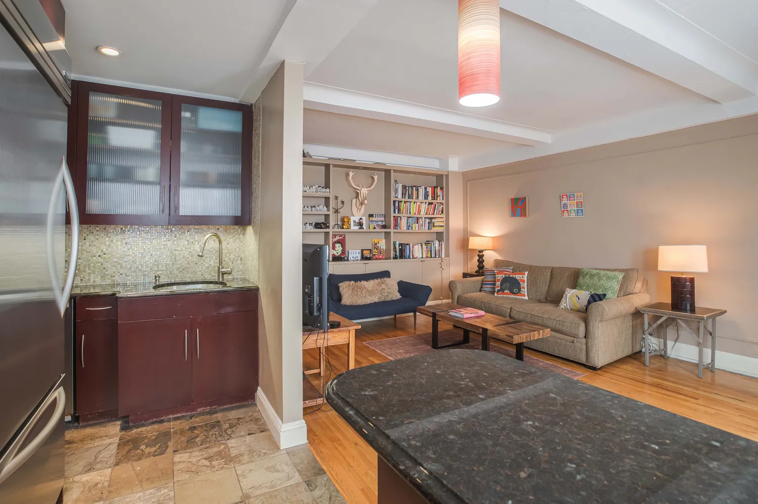 a living room with furniture and a fireplace