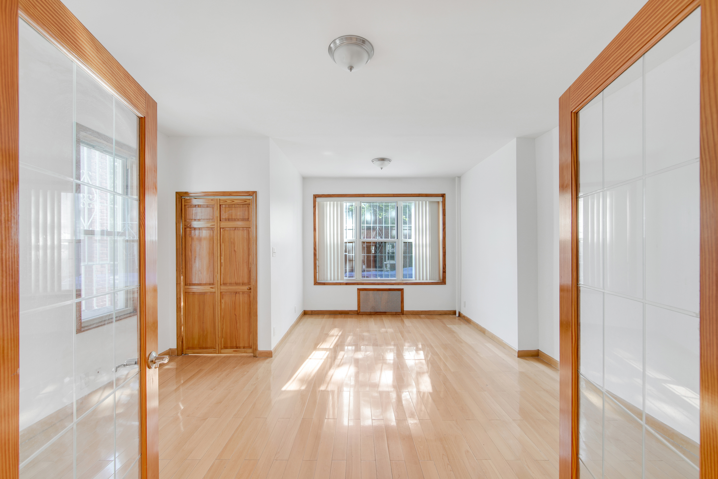 1759 West 1st Street Brooklyn, NY 11223 - Photo 3 of 21 a view of an empty room with a window