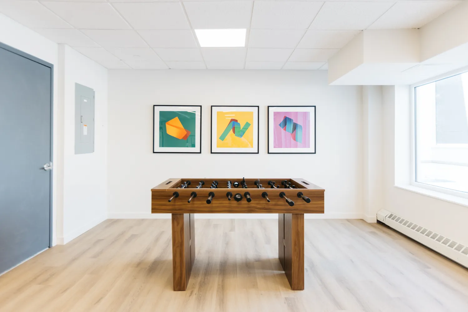 a room with furniture and painting on wall