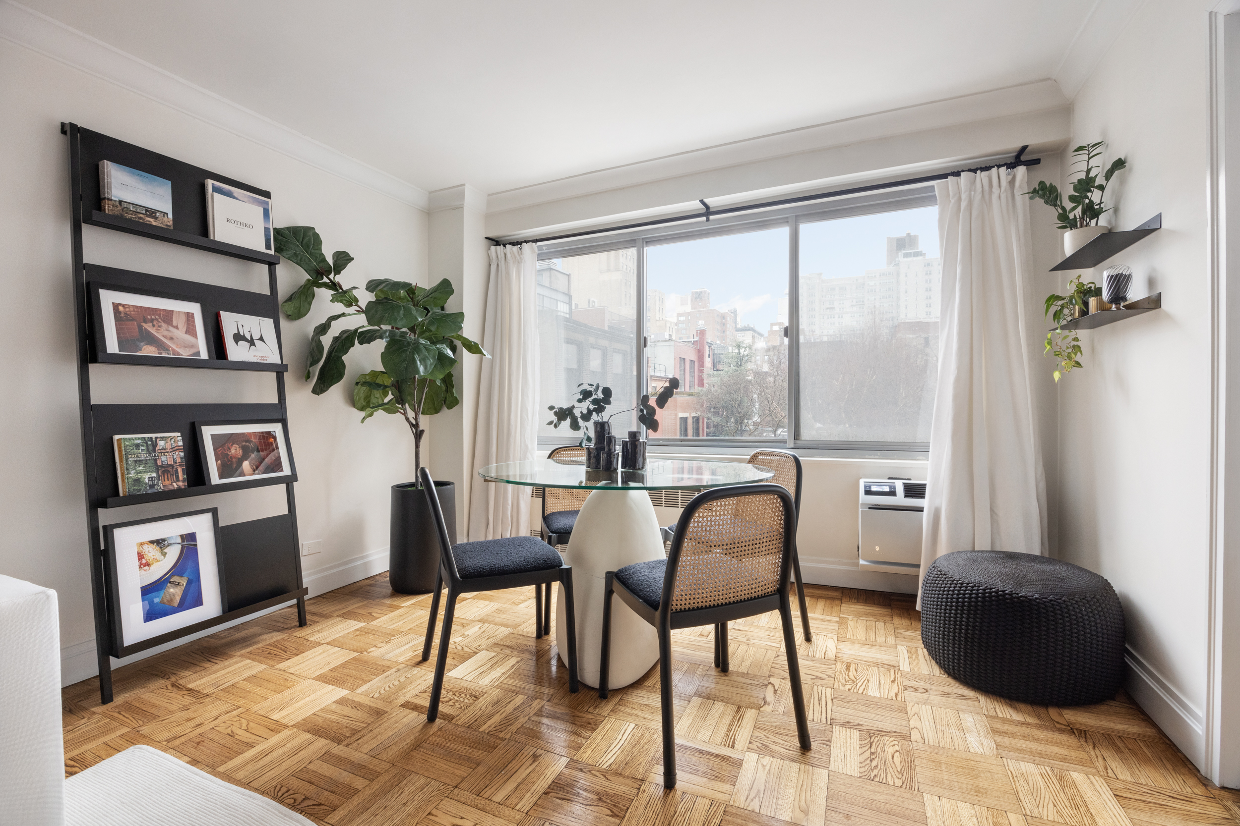 175 West 12th Street, Unit 4L Manhattan, NY 10011 - Photo 3 of 11 a dining room with furniture and window