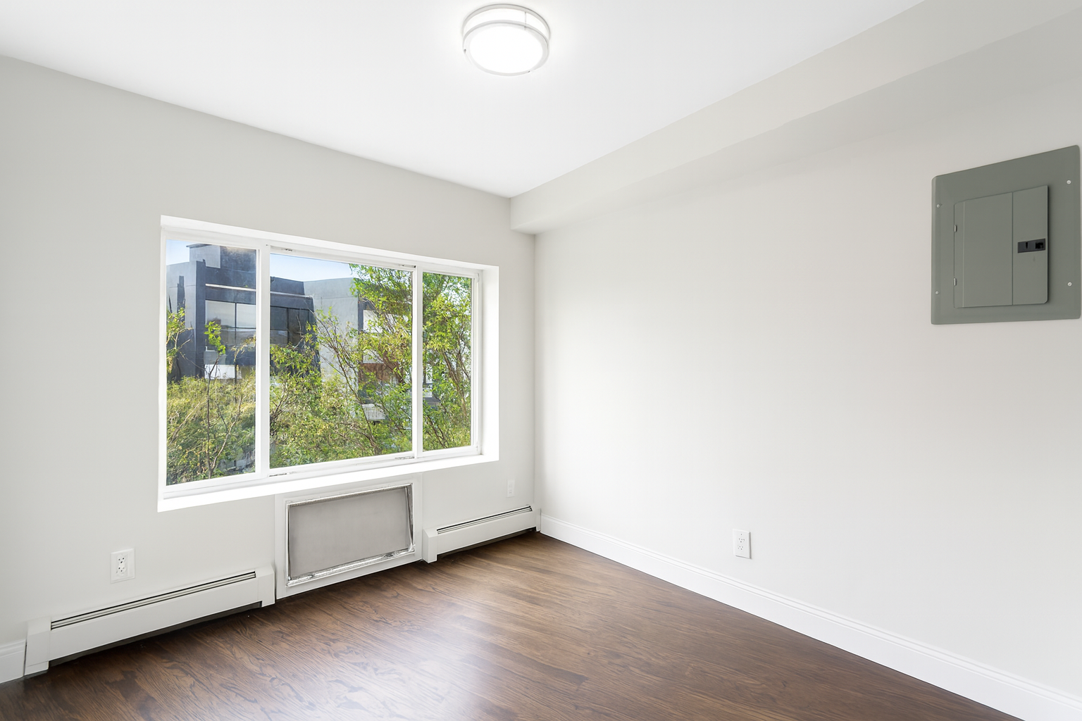 189 Woodpoint Road Brooklyn, NY 11211 - Photo 8 of 21 a view of an empty room with a window