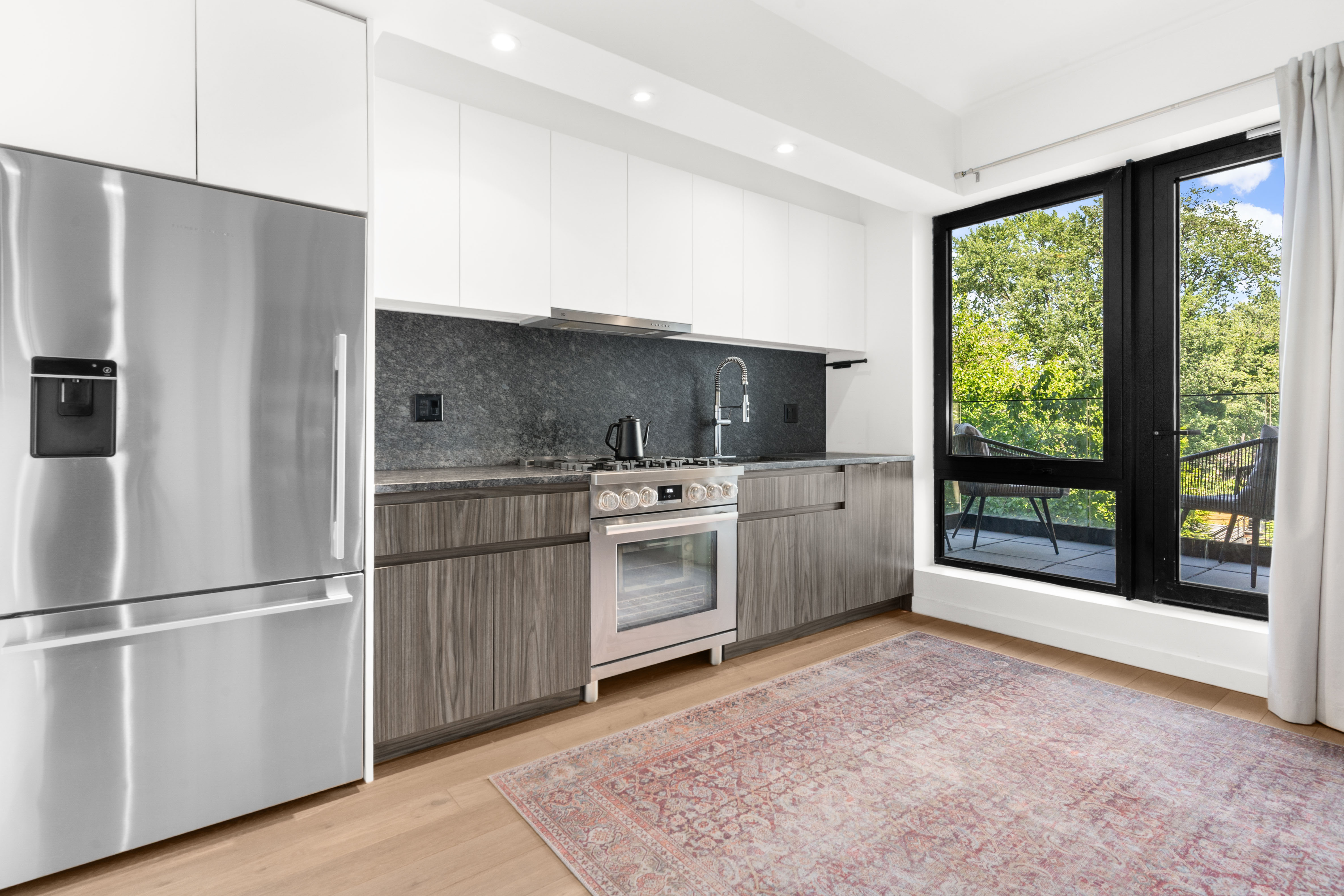435 Tompkins Avenue, Unit 303 Brooklyn, NY 11216 - Photo 4 of 10 a kitchen with a refrigerator and a sink