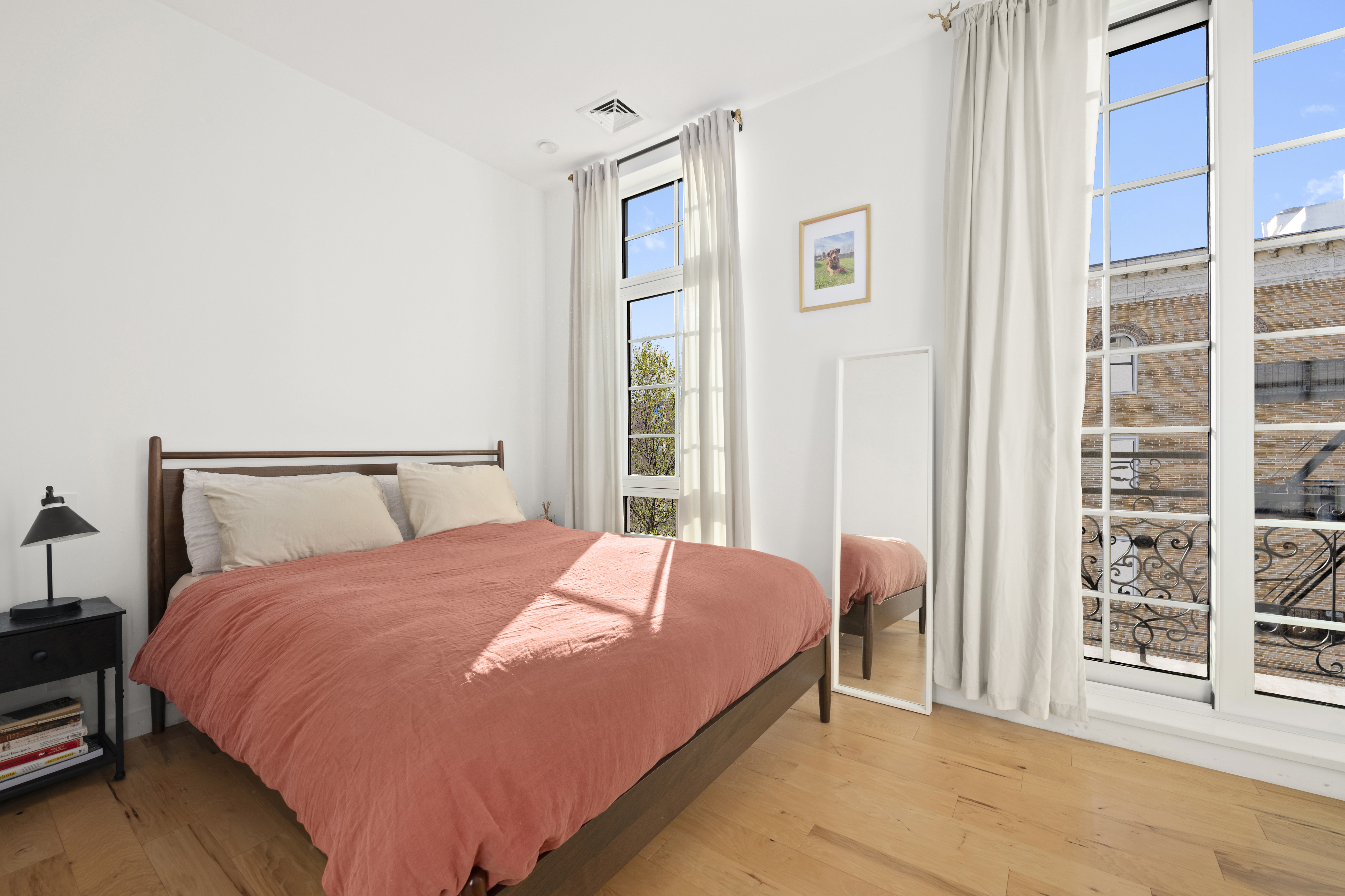 278 Nassau Avenue, Unit 3B Brooklyn, NY 11222 - Photo 5 of 12 a bedroom with a large bed and a window