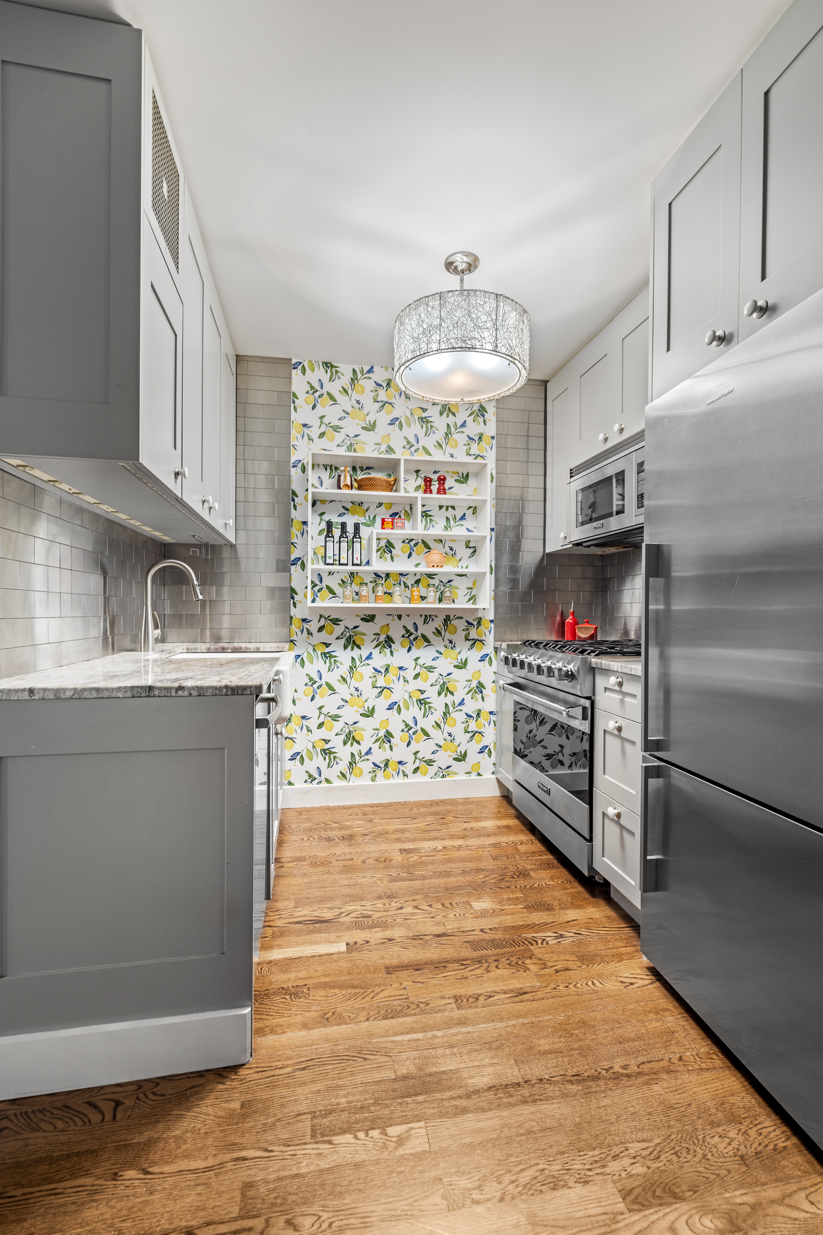 118 Union Street, Unit 9A Brooklyn, NY 11231 - Photo 3 of 10 a kitchen with granite countertop a refrigerator and a stove