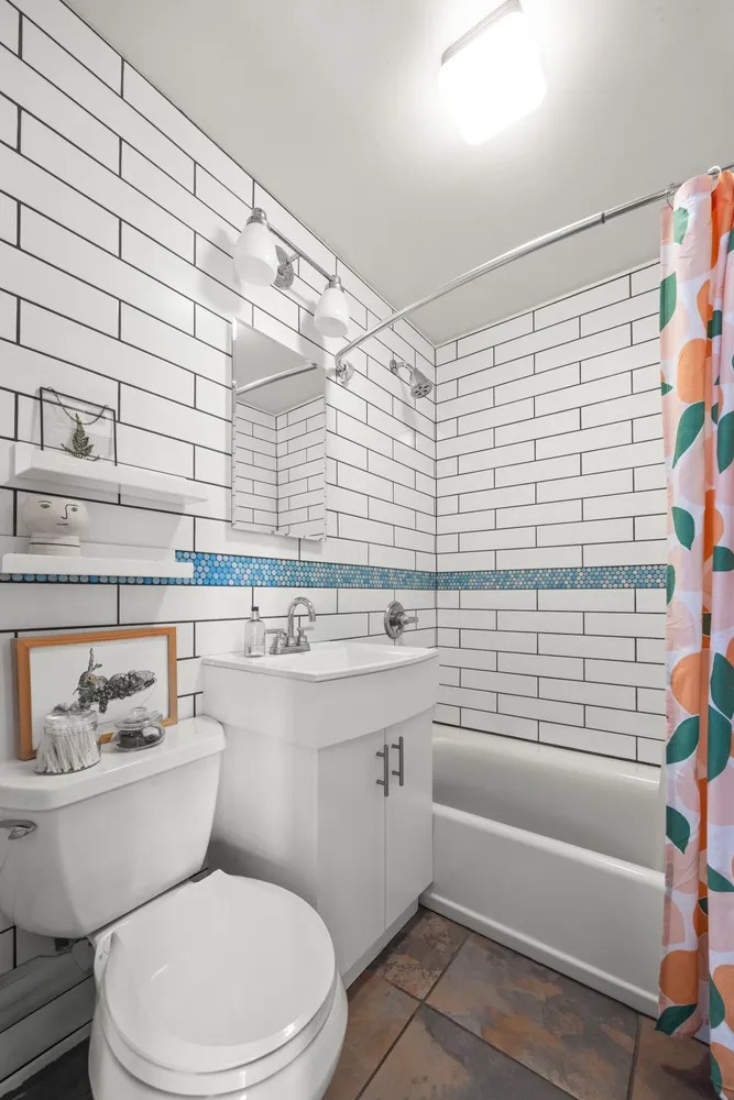 a bathroom with a sink a toilet and bathtub