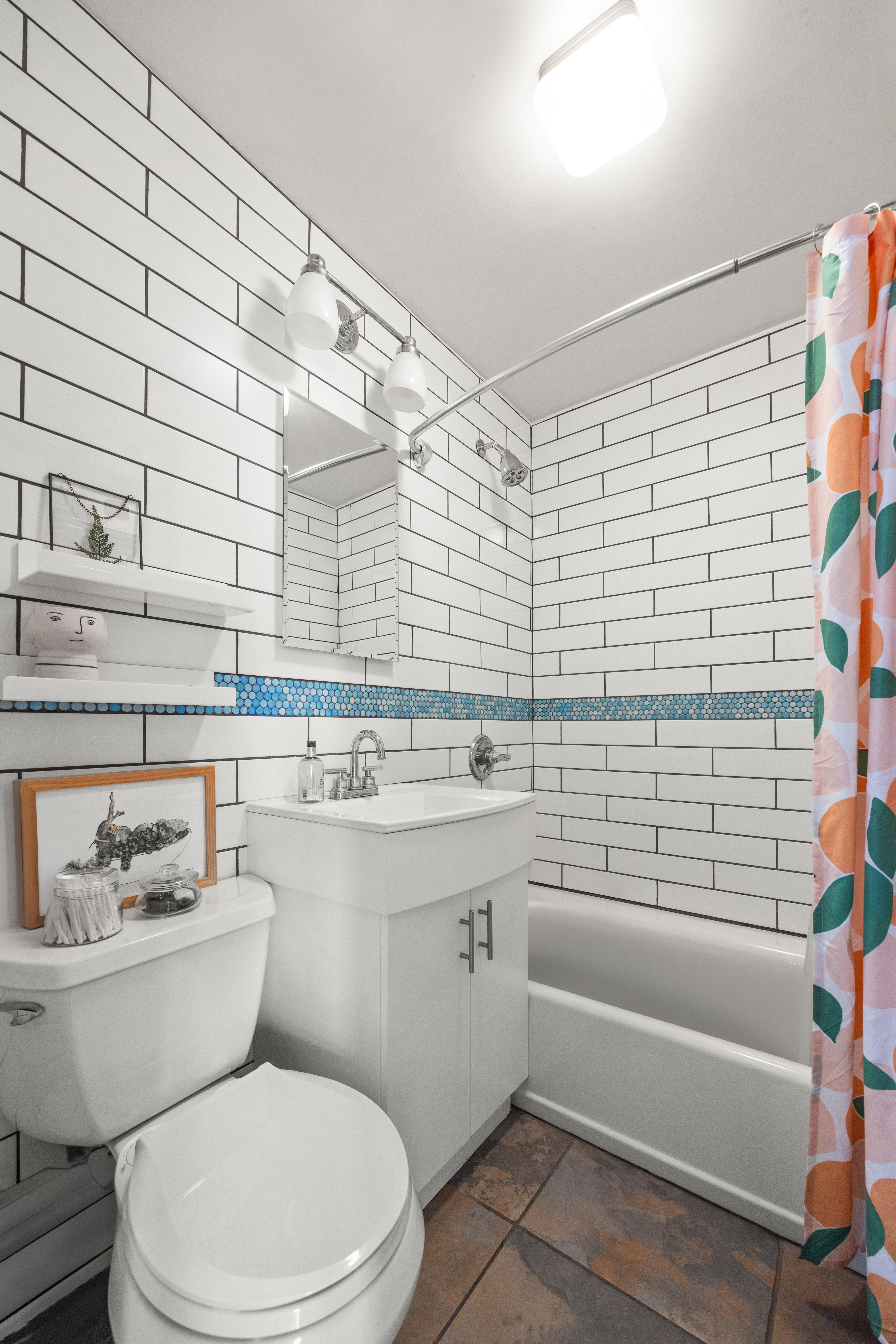 44 Turner Place, Unit 2 Brooklyn, NY 11218 - Photo 9 of 9 a bathroom with a sink a toilet and bathtub