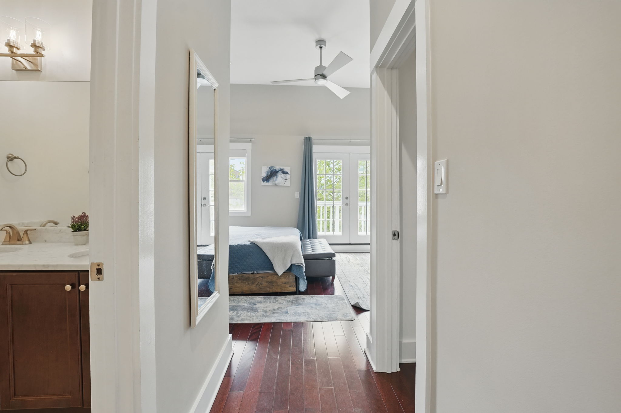 28 Q Street Northeast, Unit 2 Washington, DC 20002 - Photo 21 of 41 a view of a hallway with wooden floor and a bathroom
