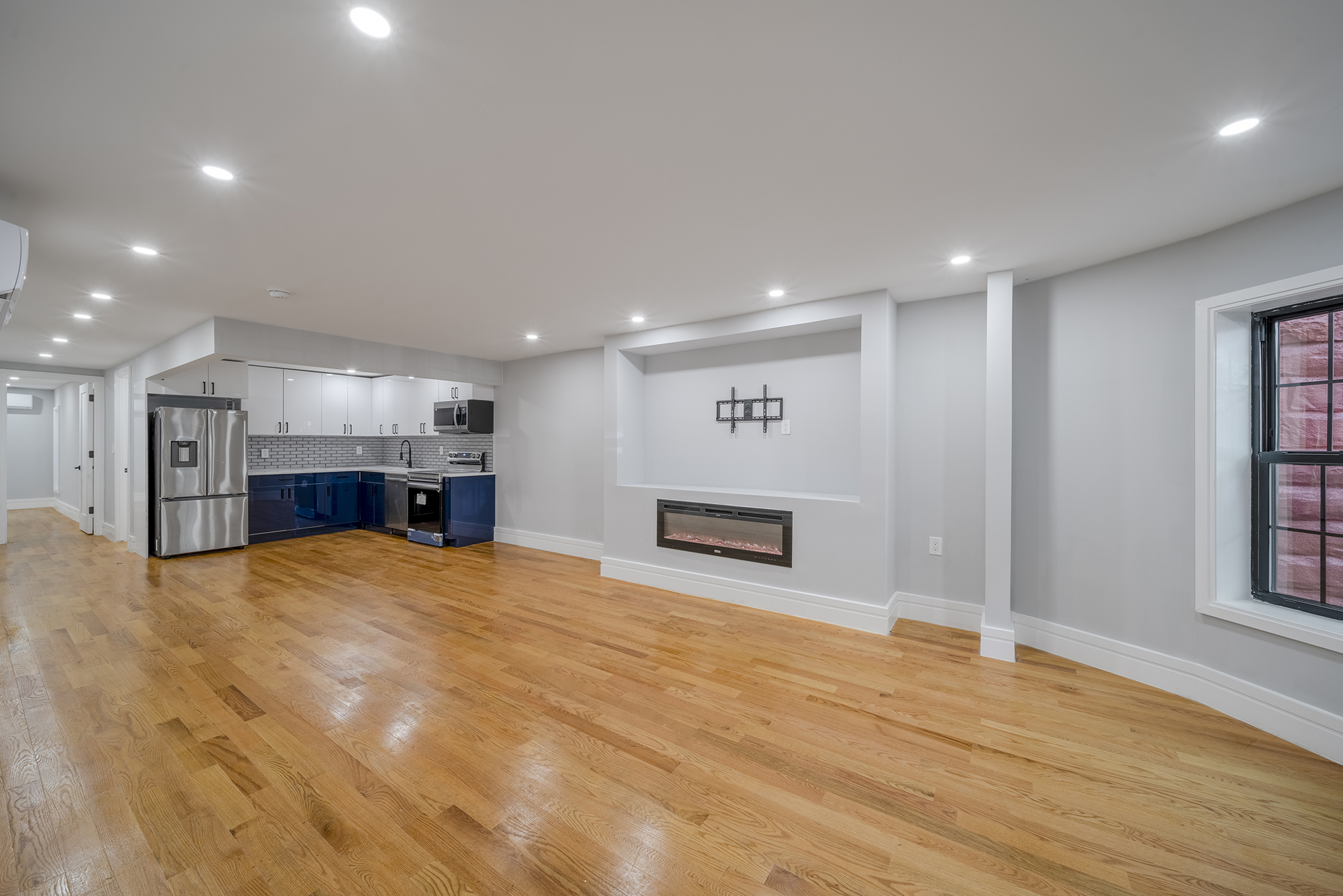 192 Weirfield Street, Unit ONE Brooklyn, NY 11221 - Photo 2 of 8 a view of an empty room with a kitchen
