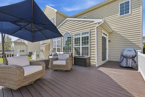 a view of a garden with a house in the background