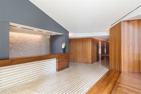 a view of a room with wooden floor and chair