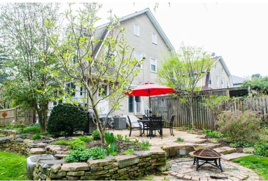 201 West Avenue Wayne, PA 19087 - Photo 2 of 26 a patio with a patio table and chairs under an umbrella