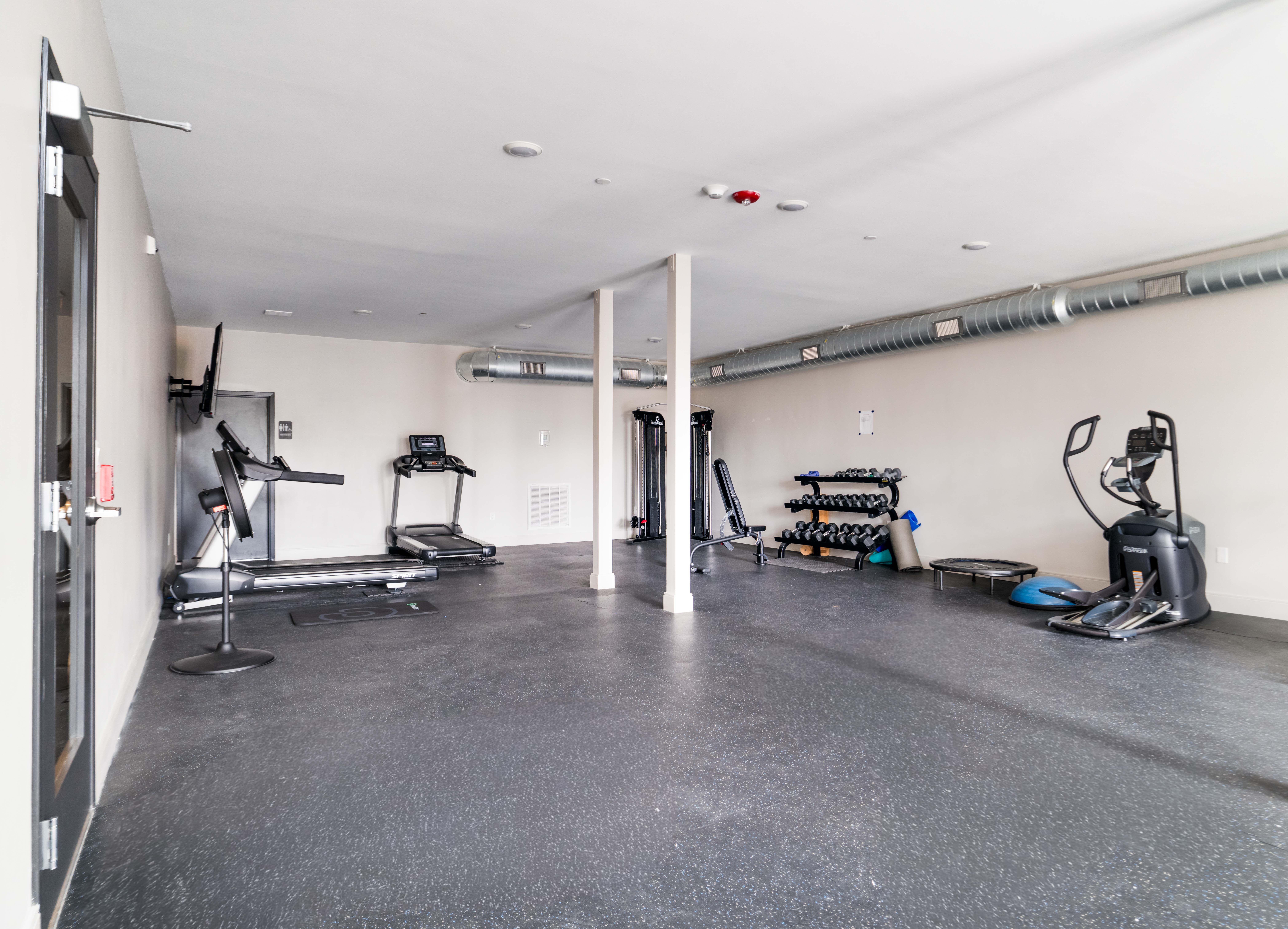 85 Myrtle Street, Unit 110 Quincy, MA 02171 - Photo 10 of 13 a view of a room with gym equipment