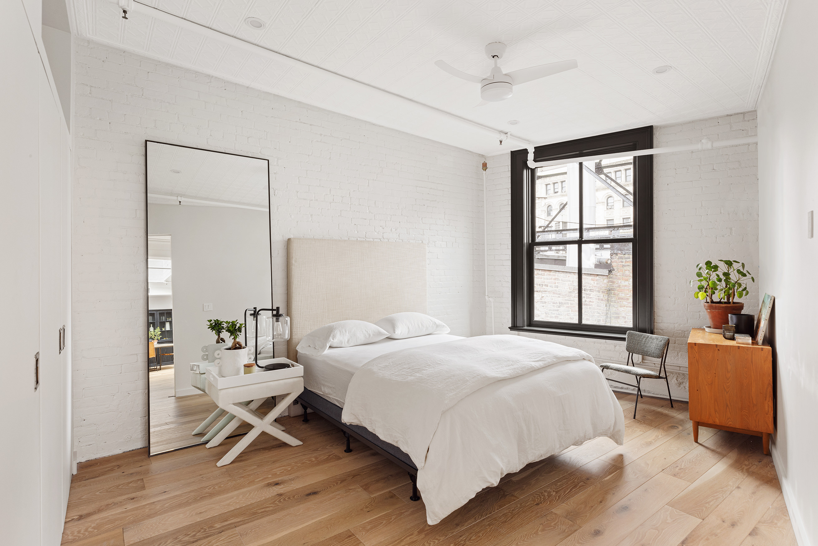 22 East 18th Street, Unit PH6B Manhattan, NY 10003 - Photo 6 of 13 a bedroom with a bed and a window