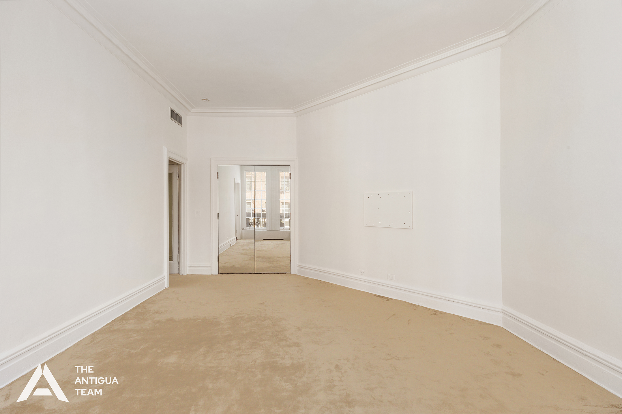 45 East 66th Street, Unit 4W Manhattan, NY 10065 - Photo 13 of 27 a view of an empty room with a window