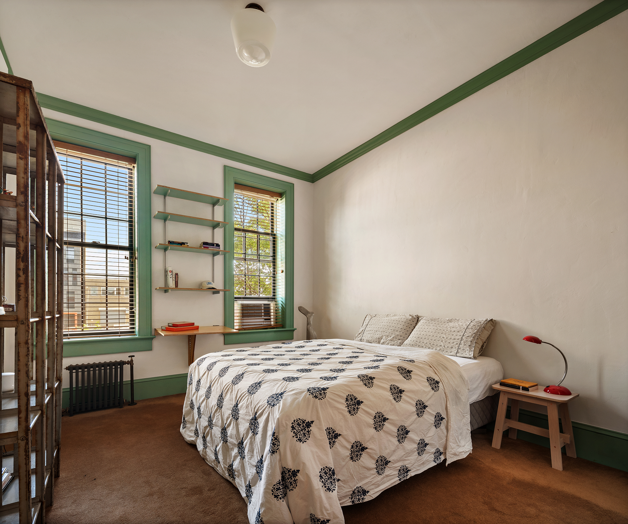 164 Coffey Street Brooklyn, NY 11231 - Photo 15 of 31 a bedroom with a bed lamp and a window