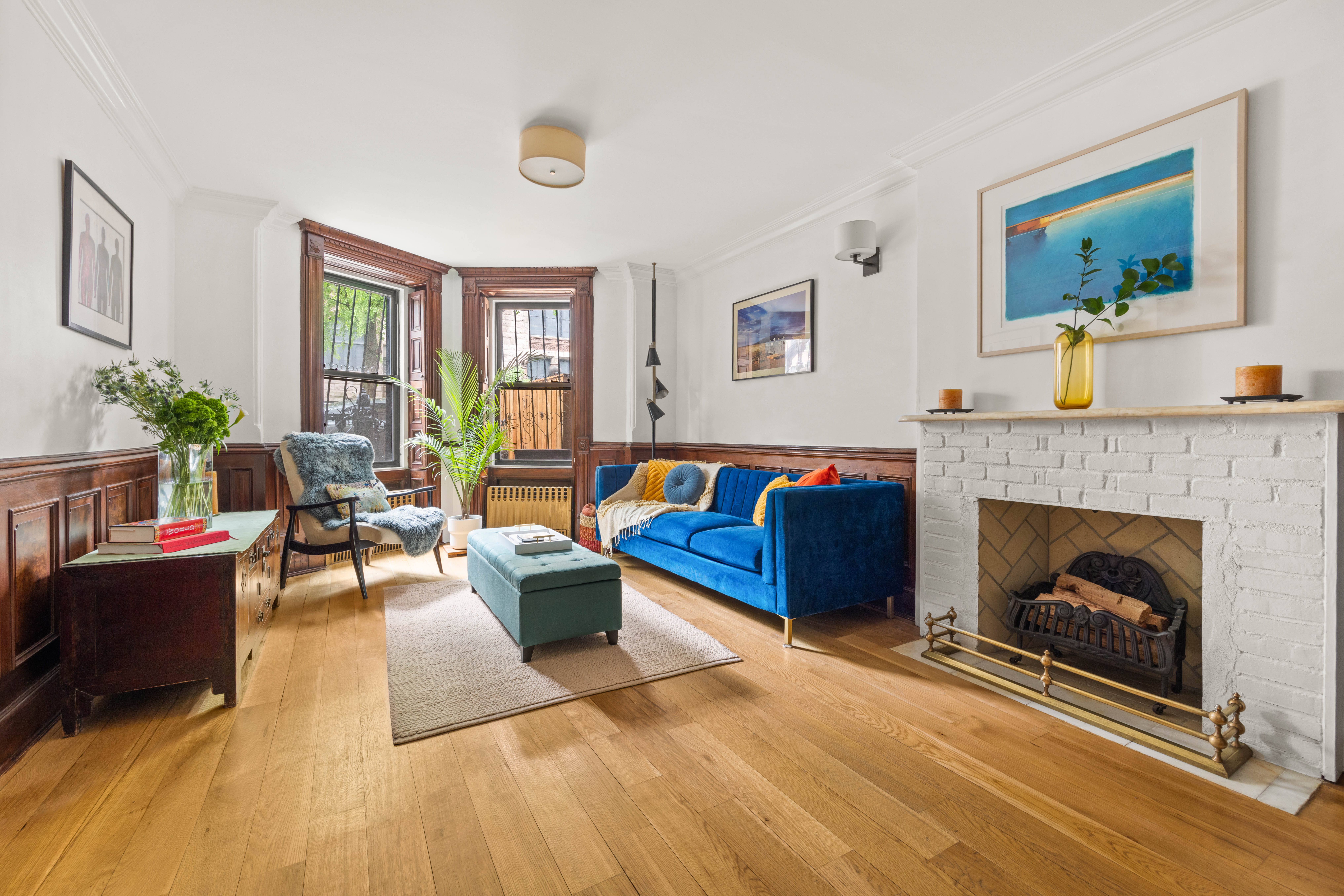 38 7th Avenue, Unit 1 Brooklyn, NY 11217 - Photo 1 of 13 a living room with furniture and a fireplace