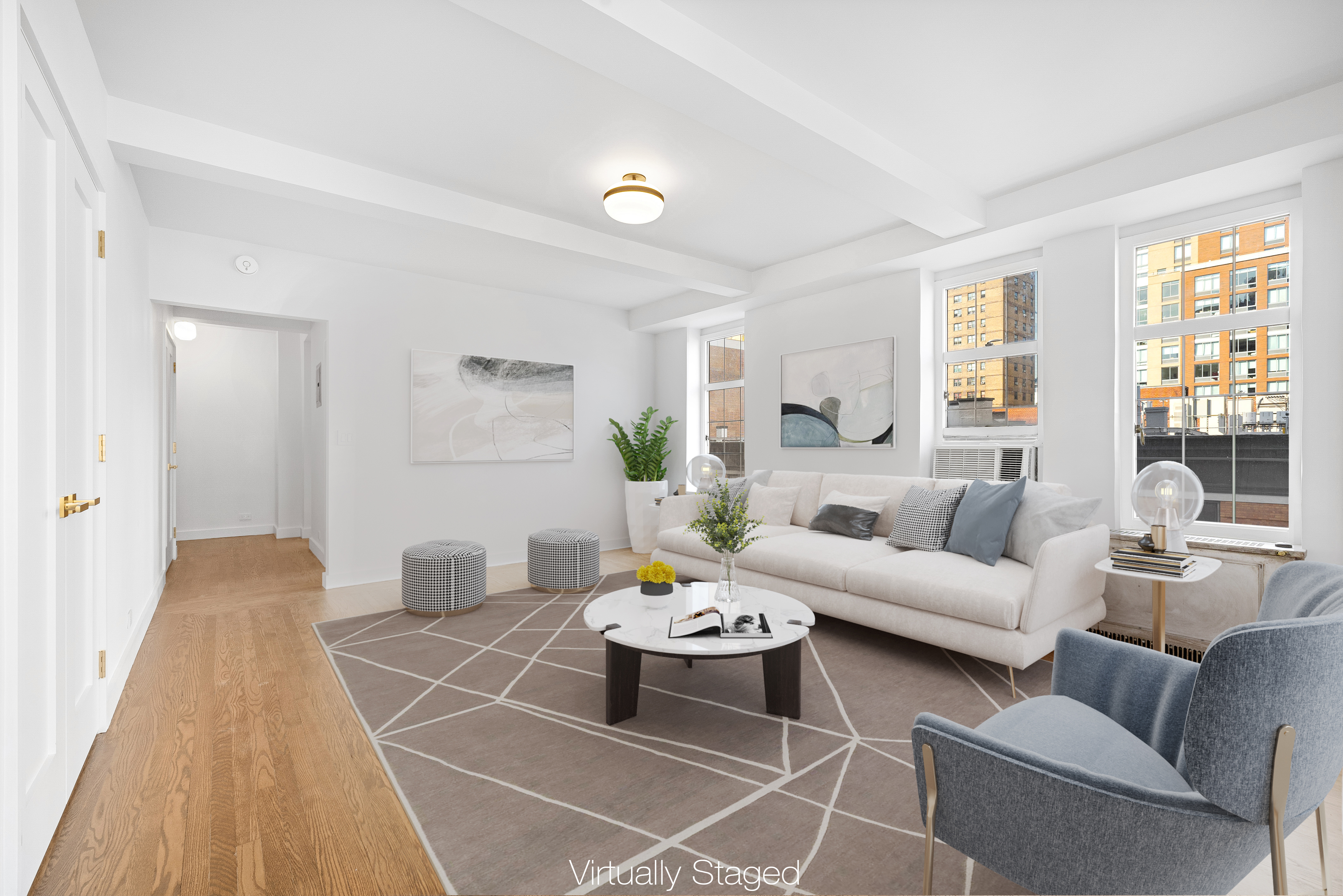 410 West 24th Street, Unit 8F Manhattan, NY 10011 - Photo 12 of 16 a living room with furniture and a table