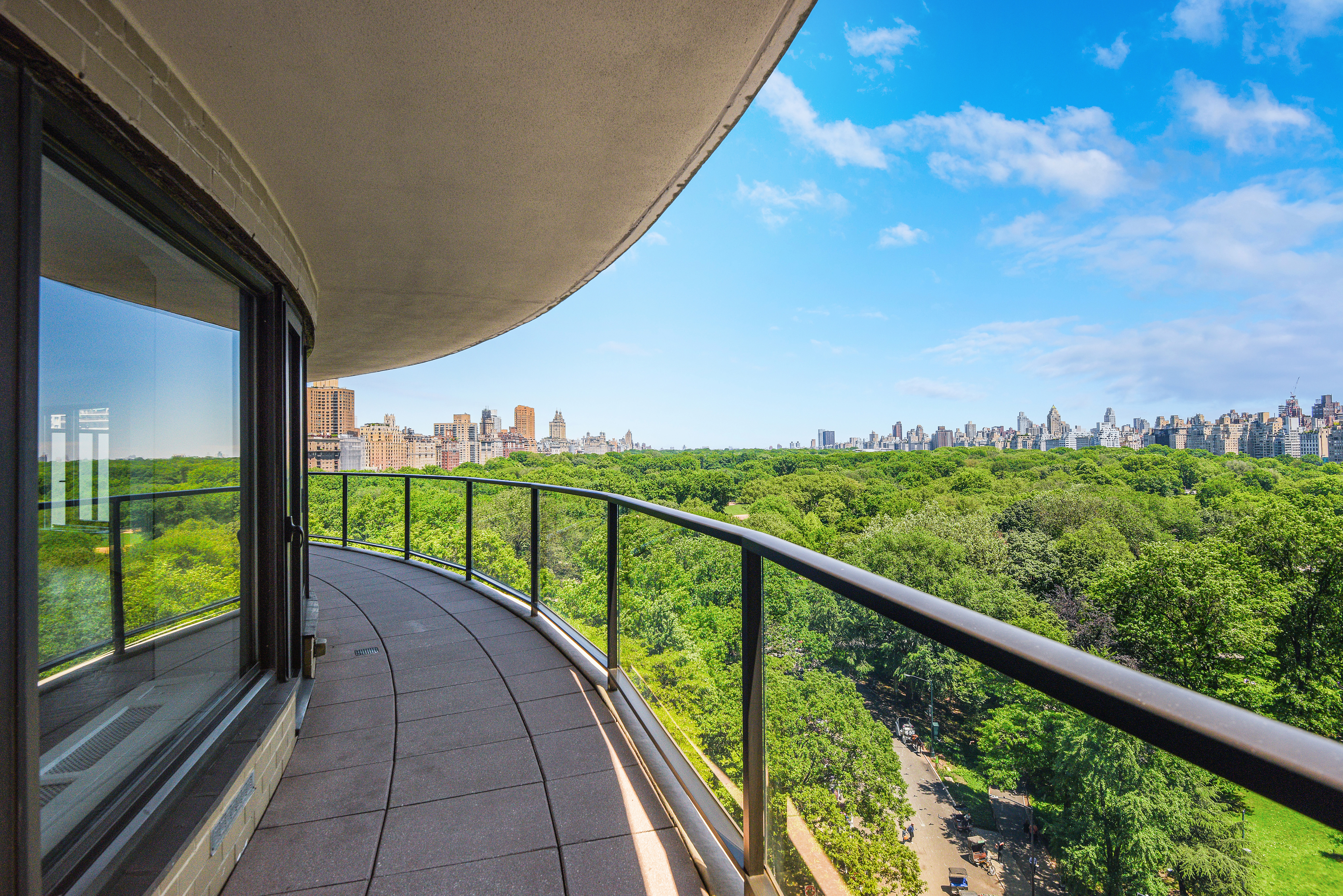 200 Central Park South, Unit 14B Manhattan, NY 10019 - Photo 10 of 17 a view of balcony with floor to ceiling windows with wooden floor