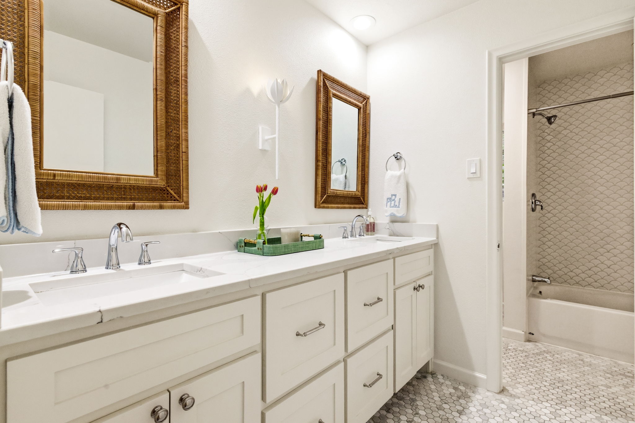 5765 Stonegate Road Dallas, TX 75209 - Photo 27 of 37 a bathroom with double sink and a mirror