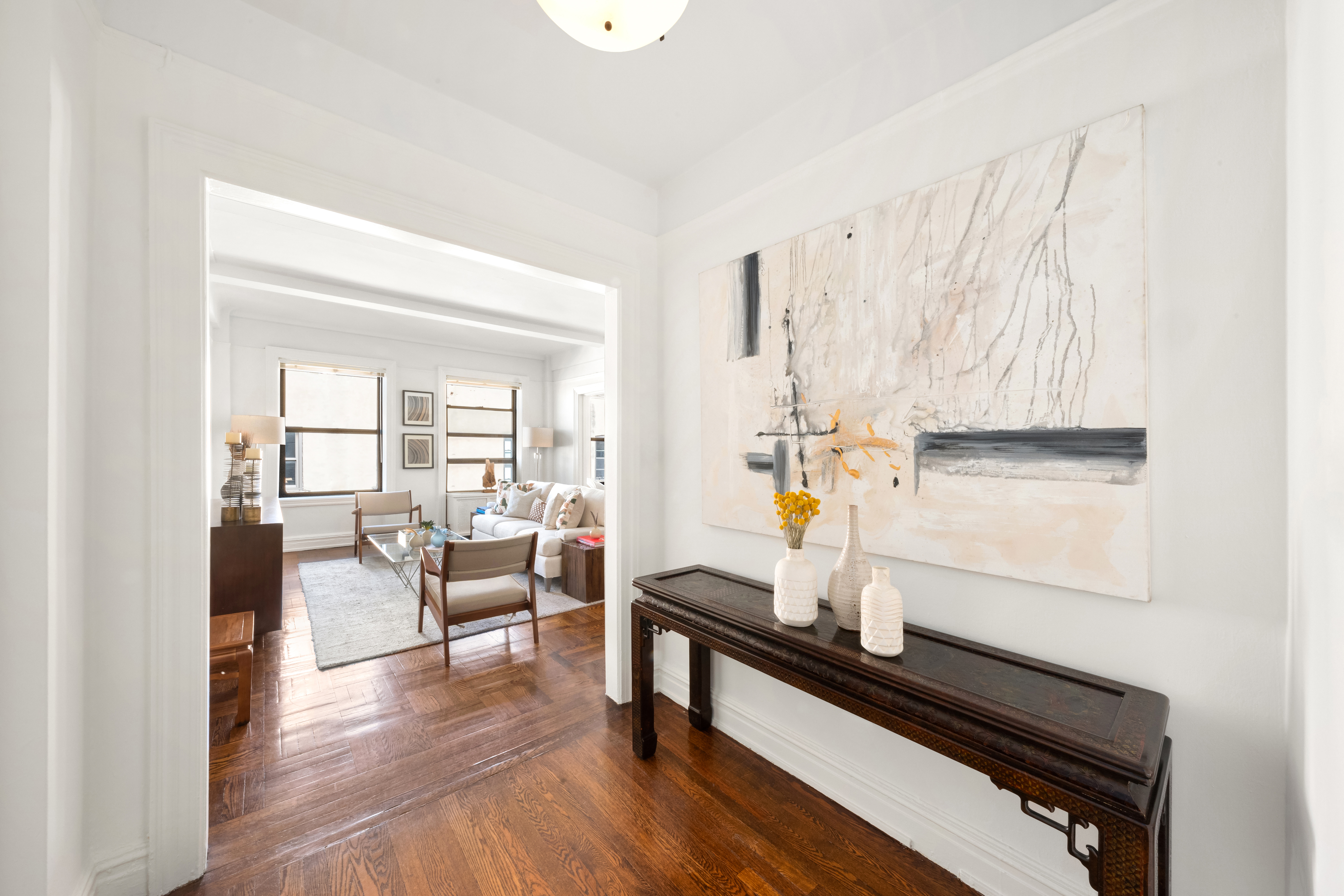 41 West 82nd Street, Unit 9D Manhattan, NY 10024 - Photo 12 of 15 a living room with furniture and wooden floor