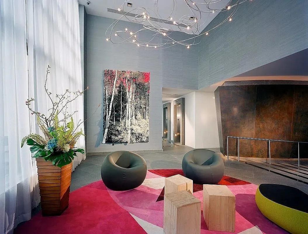 325 5th Avenue, Unit 14E Manhattan, NY 10016 - Photo 10 of 19 a living room with furniture and a potted plant