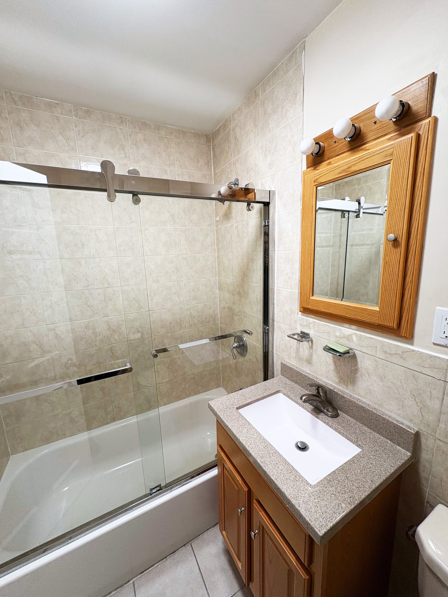 179 Covert Street, Unit 3 Brooklyn, NY 11207 - Photo 14 of 14 a bathroom with a sink and a mirror