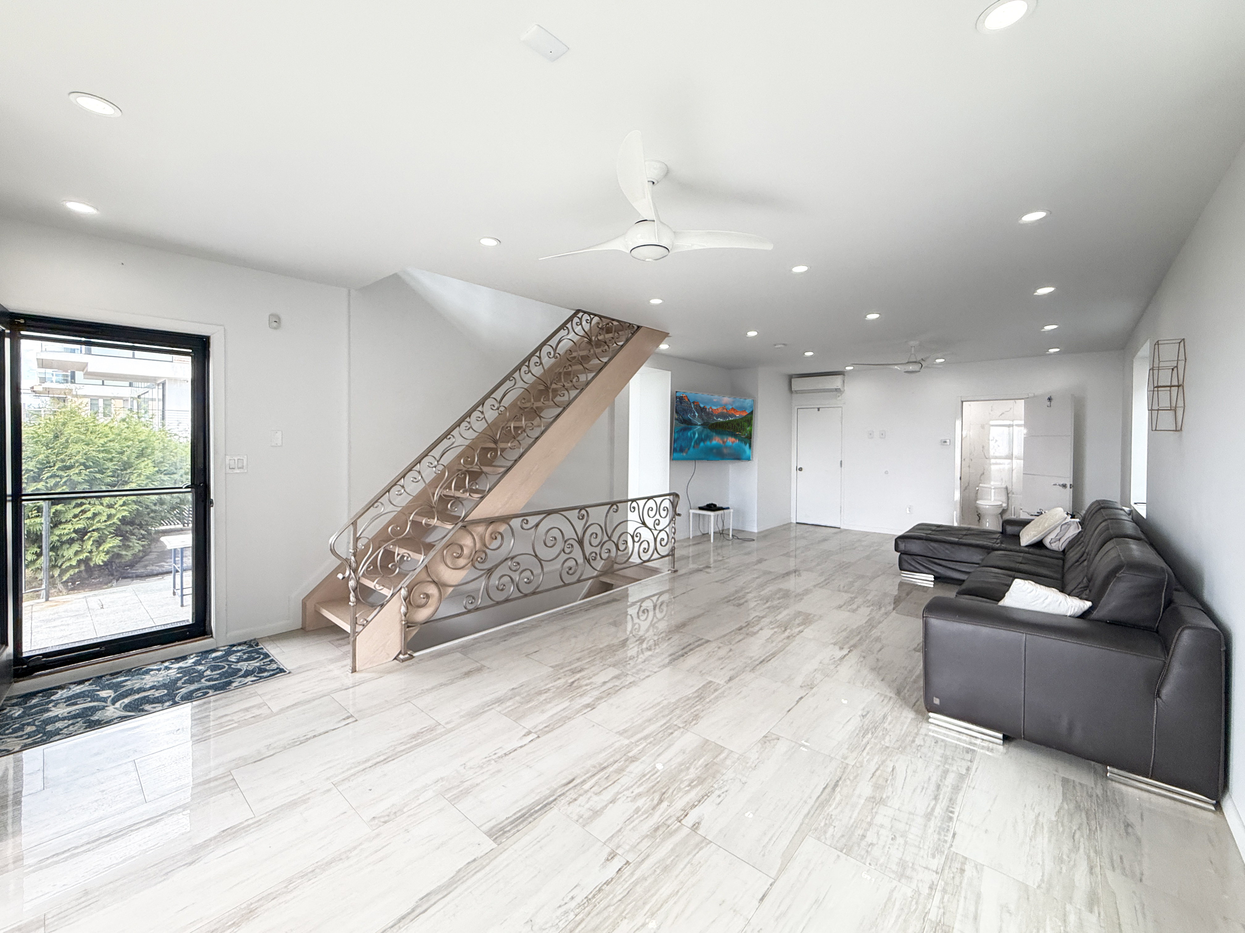 3848 Atlantic Avenue Brooklyn, NY 11224 - Photo 10 of 29 a living room with furniture windows and wooden floor