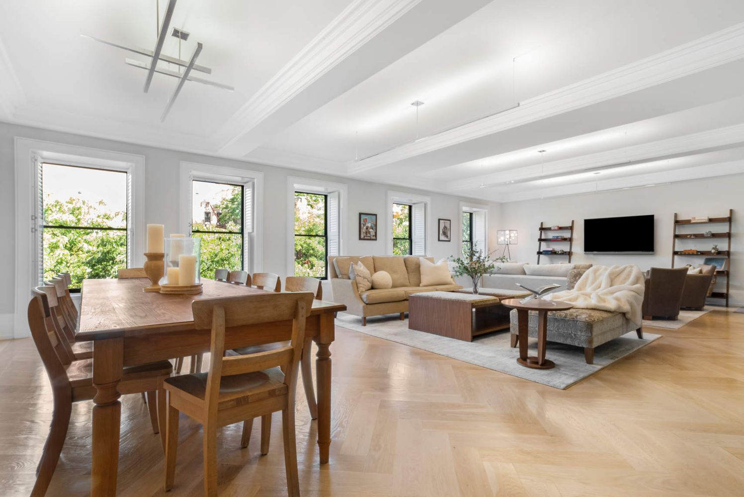 182 West 82nd Street, Unit 4E Manhattan, NY 10024 - Photo 4 of 25 a living room with furniture and a flat screen tv