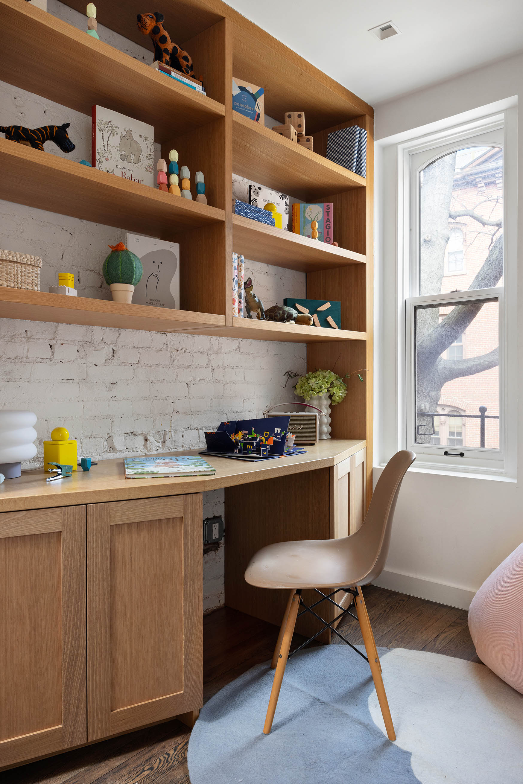 148 Warren Street Brooklyn, NY 11201 - Photo 13 of 20 a kitchen with a sink a stove and a bookshelf with wooden floor