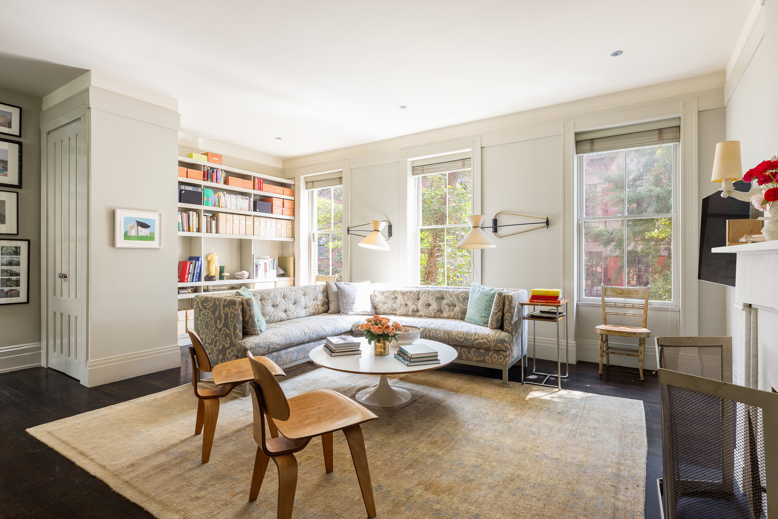 25 Perry Street Manhattan, NY 10014 - Photo 12 of 32 a living room with furniture and a window