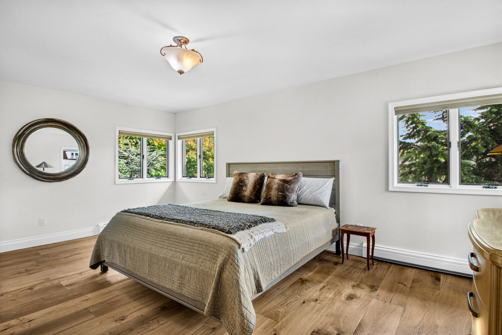 165 Swaim Avenue Staten Island, NY 10312 - Photo 12 of 45 a bedroom with a bed a window and a chandelier