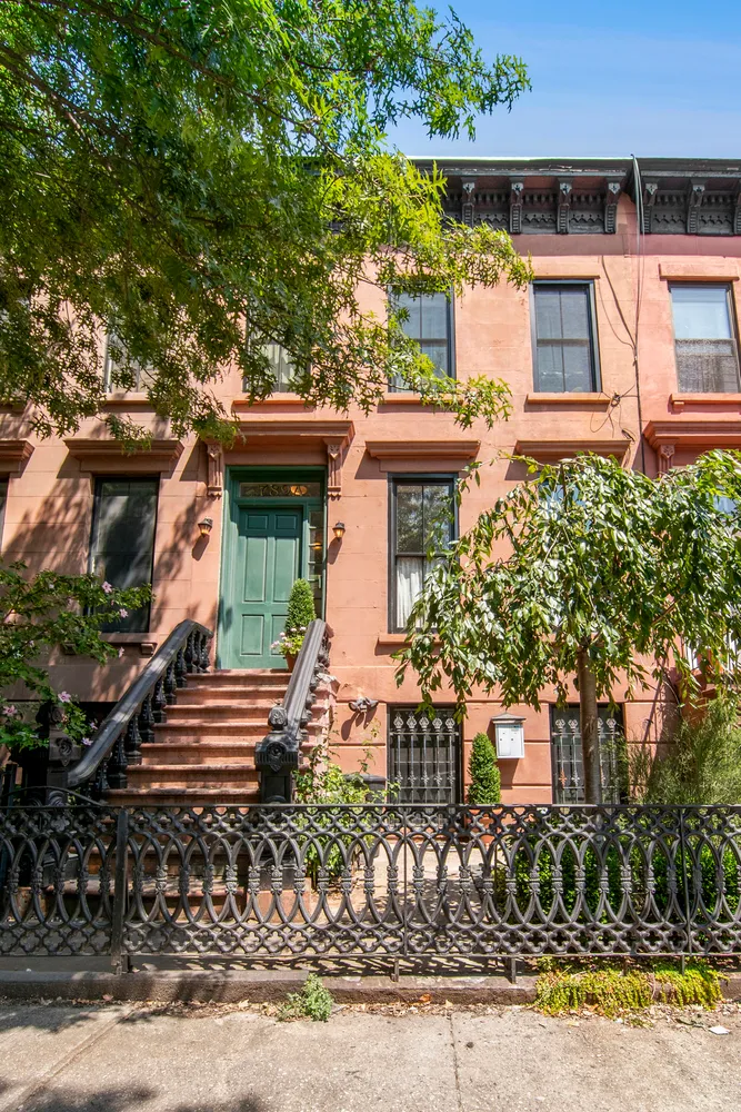 front view of a house with a small yard