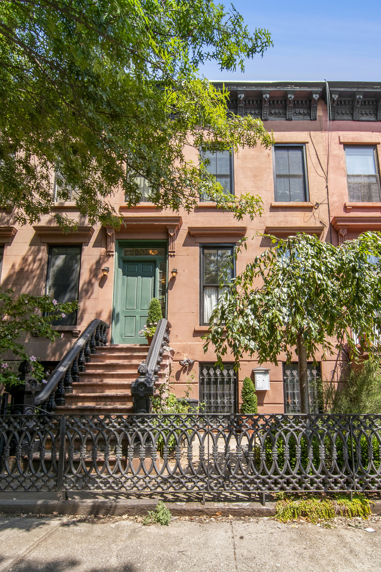 789 A Monroe Street, Unit 2 Brooklyn, NY 11221 - Photo 6 of 8 front view of a house with a small yard