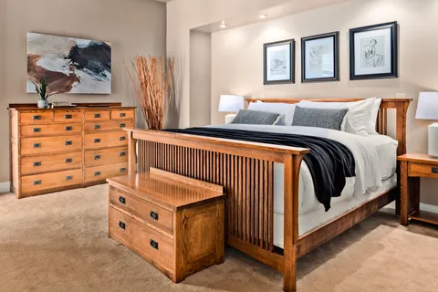 a bedroom with a bed and a cabinets