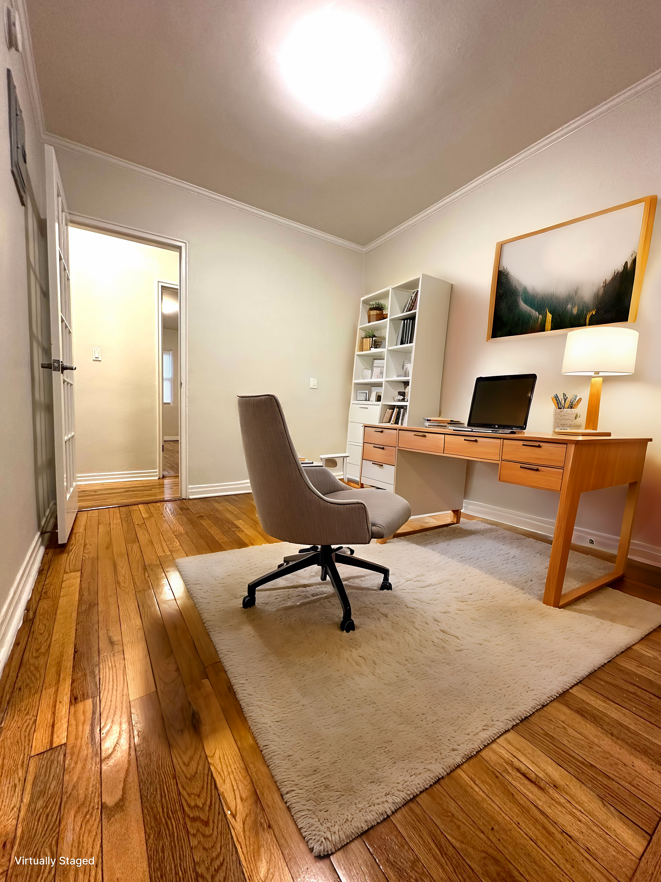 75-66 197th Street Queens, NY 11366 - Photo 3 of 14 a workspace with wooden floor and bedroom