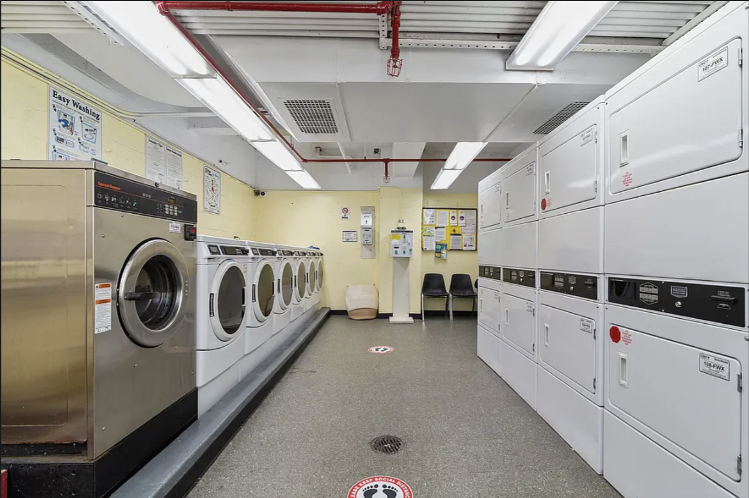 170 West 23rd Street, Unit 5X Manhattan, NY 10011 - Photo 6 of 9 a utility room with dryer and washer