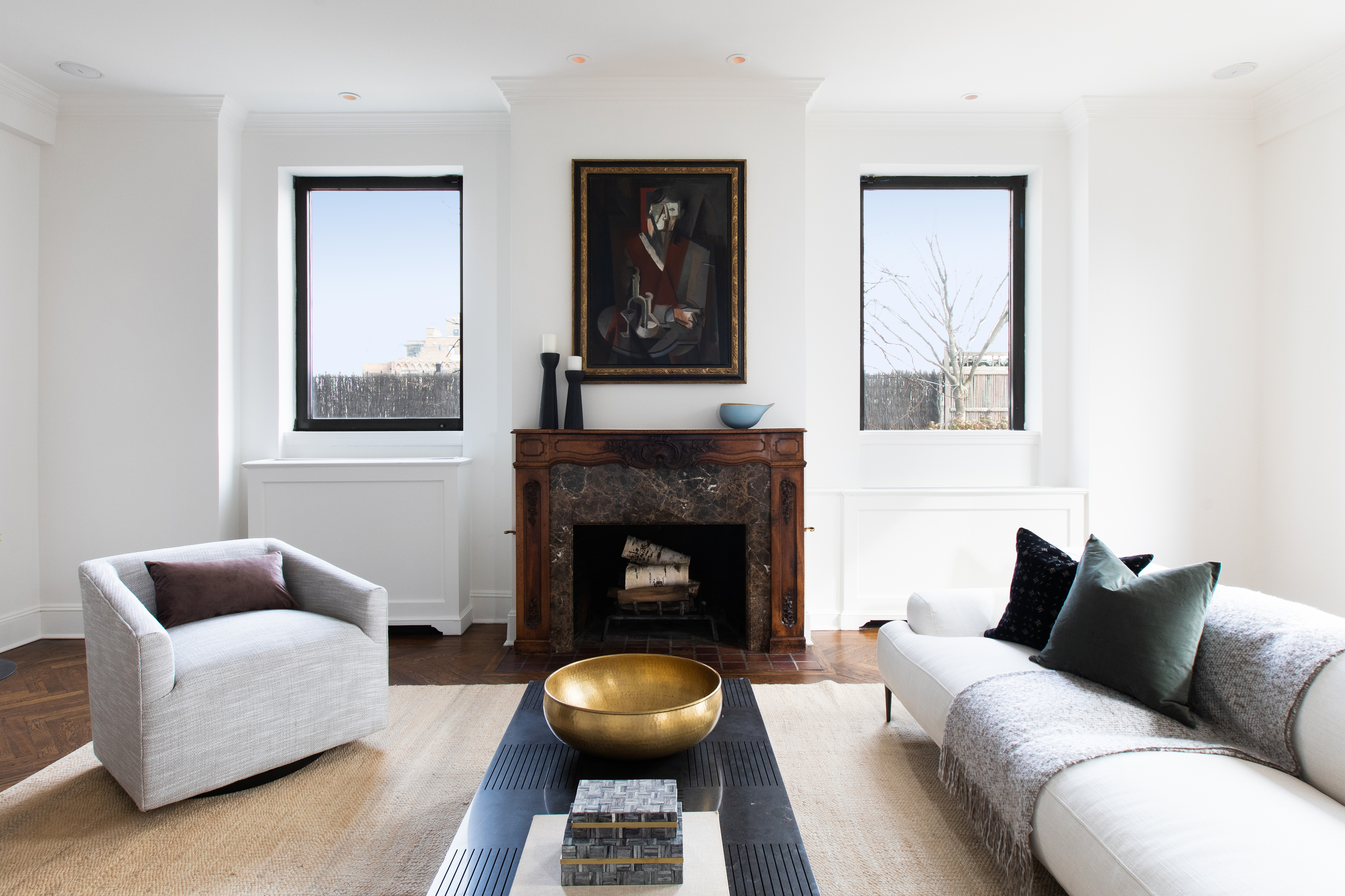 1070 Park Avenue, Unit PHE Manhattan, NY 10128 - Photo 3 of 14 a living room with furniture and a fireplace