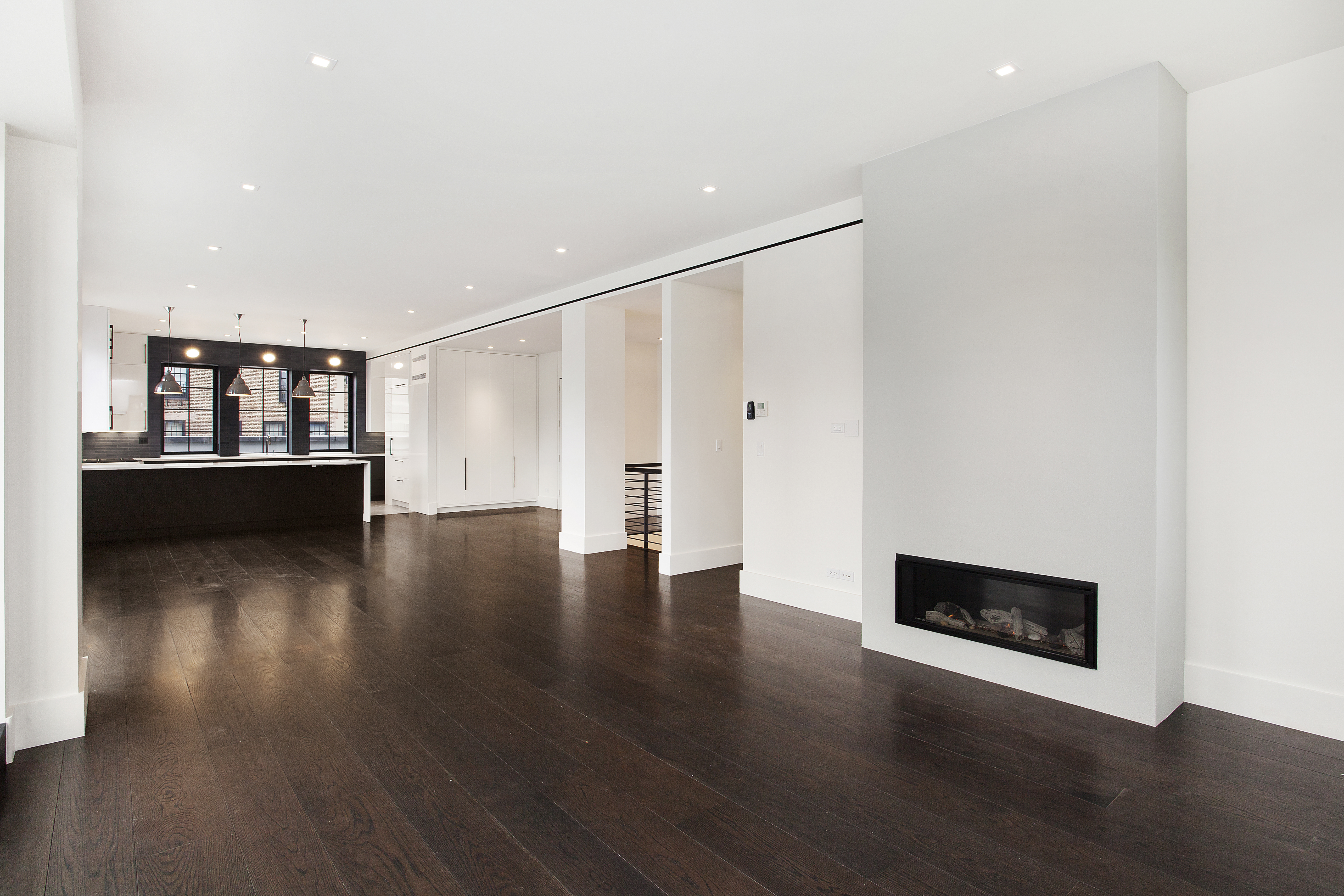 East 80th Street Manhattan, NY 10075 - Photo 2 of 13 a view of a room with wooden floor and kitchen view