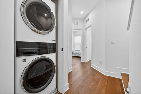 a view of a hallway with washer and dryer