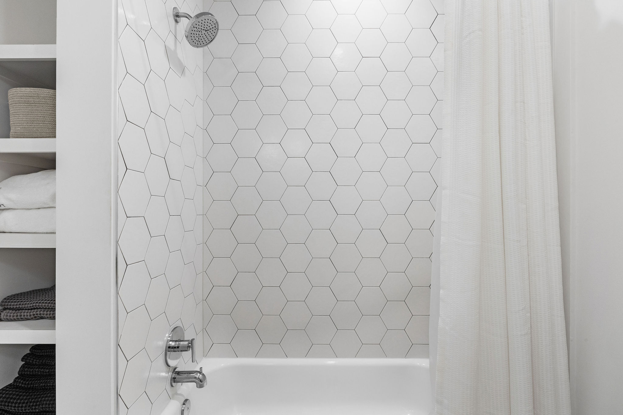 800 Embassy Drive, Unit 236 Austin, TX 78702 - Photo 32 of 50 a bathroom with a white shower curtain and a sink