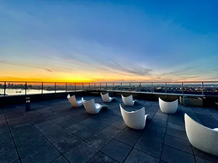 a view of a swimming pool and lounge chair