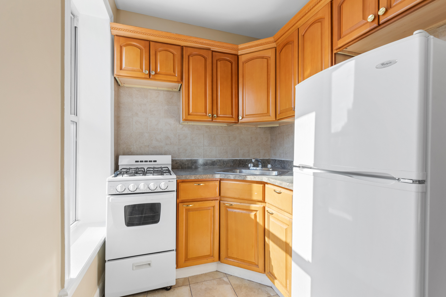 176 Bergen Street, Unit 2 Brooklyn, NY 11217 - Photo 2 of 4 a white refrigerator freezer sitting inside of a kitchen