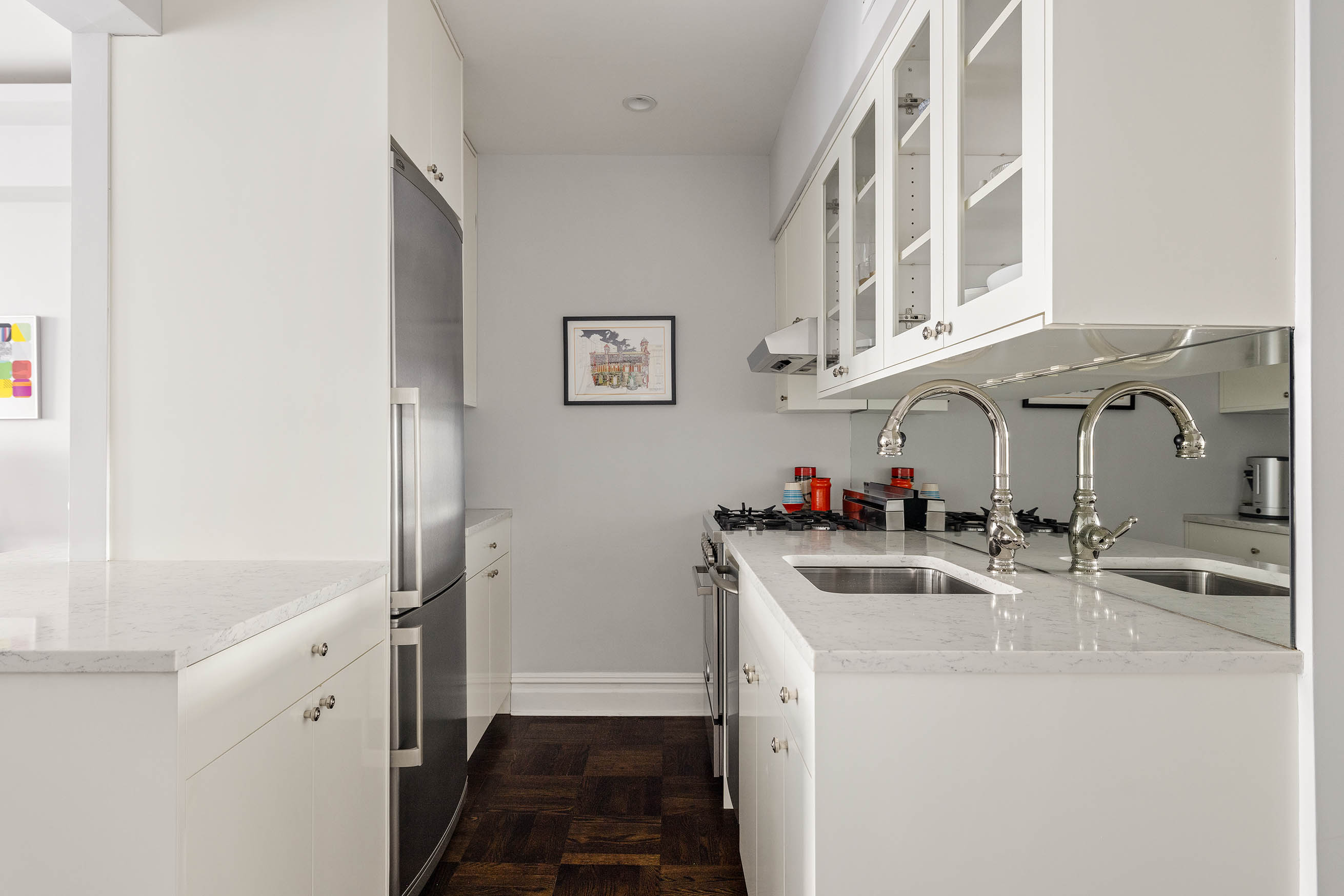 60 East 9th Street, Unit 211 Manhattan, NY 10003 - Photo 4 of 7 a bathroom with a sink and a mirror