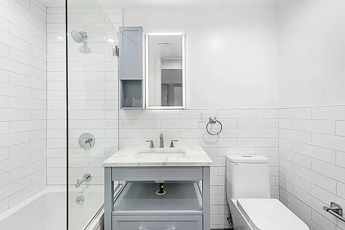 1316 Jefferson Avenue, Unit 2 Brooklyn, NY 11221 - Photo 5 of 10 a bathroom with a sink toilet and shower