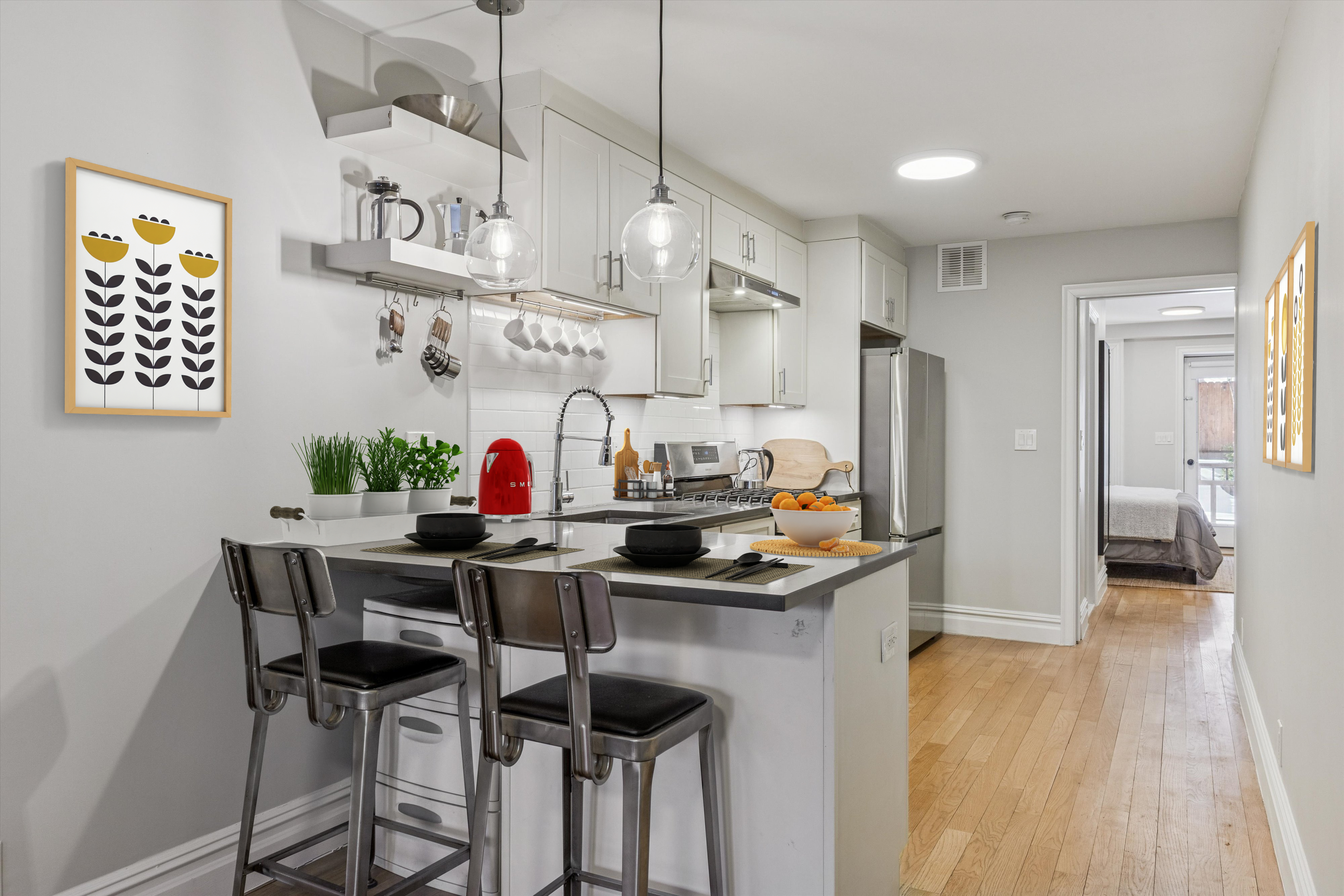 318 West 140th Street, Unit GARDEN Manhattan, NY 10030 - Photo 3 of 12 a kitchen with stainless steel appliances granite countertop a sink and a refrigerator