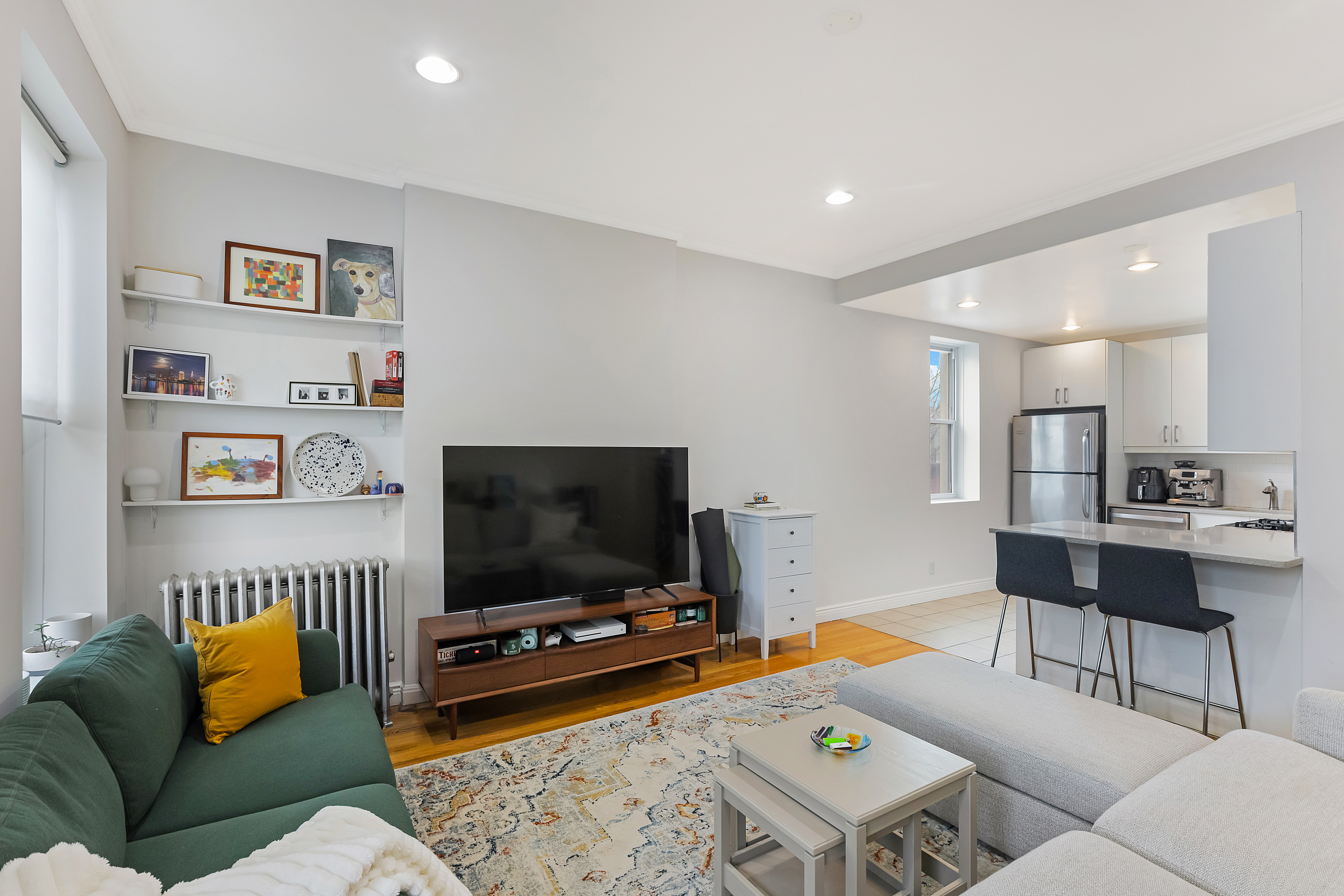 a living room with furniture and a flat screen tv