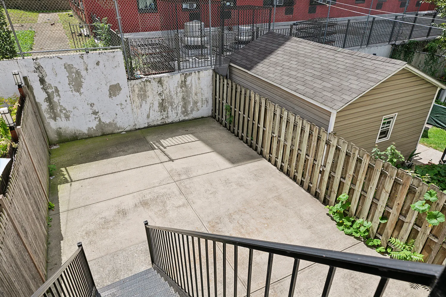 a view of a balcony with wooden floor